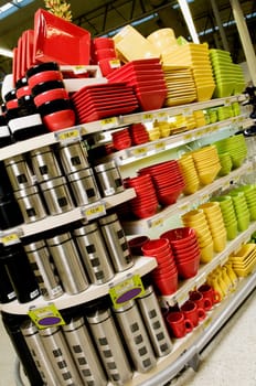 Kitchen utensils on shelves in a supermarket