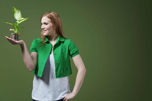 Woman looking at a seedling