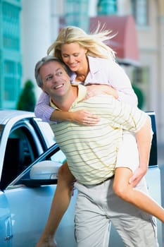 Man giving piggyback ride to his wife and smiling, Biltmore Hotel, Coral Gables, Florida, USA