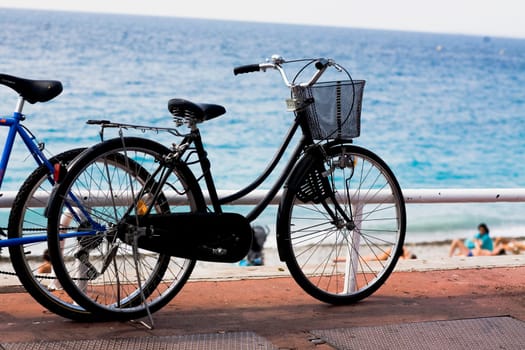 Two bicycles along a railing, Barcelona, Spain