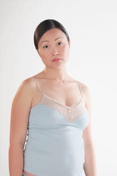 Portrait of a pregnant woman looking sad