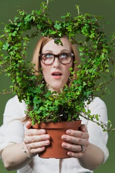 Woman holding a potted wreath