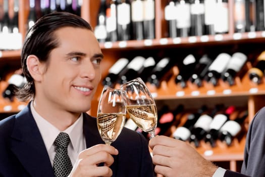 Businessmen toasting with wine