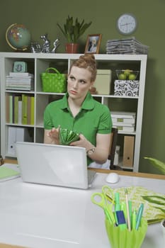 Businesswoman working on a laptop in the office