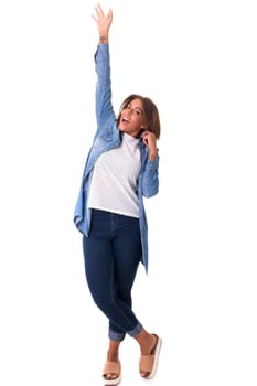 Studio shot: Happy African woman with raised arms