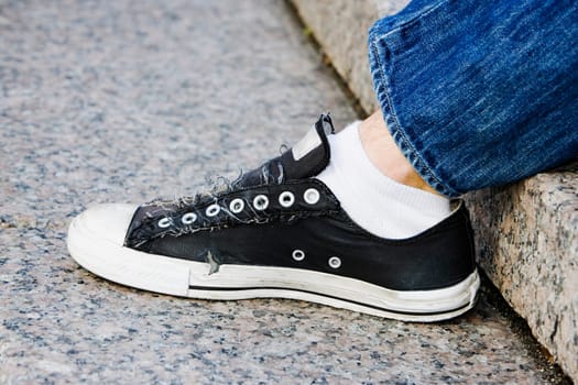 Close_up of a personŽs leg with a sneaker