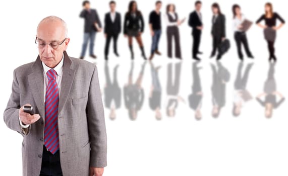 Mature business man posing, with people in background