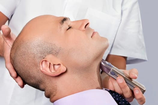 Man getting shaved in a salon