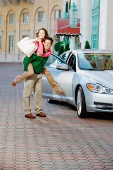 Man giving piggyback ride to his wife and smiling, Biltmore Hotel, Coral Gables, Florida, USA