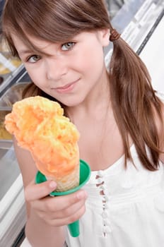 Portrait of a girl holding an ice cream