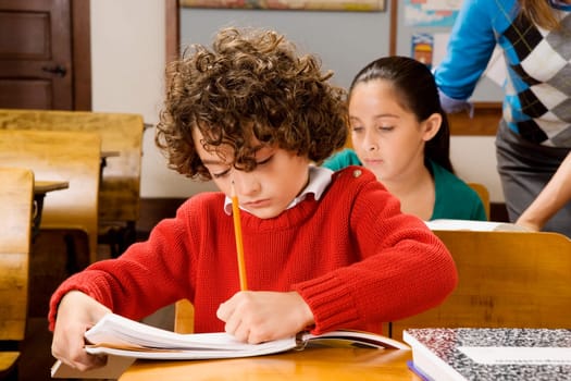 Students with their teacher in a classroom