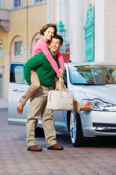 Man giving piggyback ride to his wife and smiling, Biltmore Hotel, Coral Gables, Florida, USA
