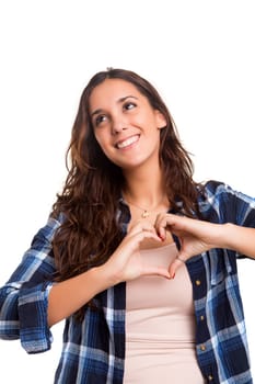 Beautiful woman making a heart shape with her hands, isolated over white background