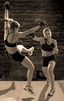 Two young women boxing