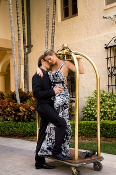 Couple romancing in front of a hotel, Biltmore Hotel, Coral Gables, Florida, USA