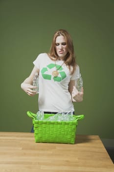 Woman holding plastic bottles
