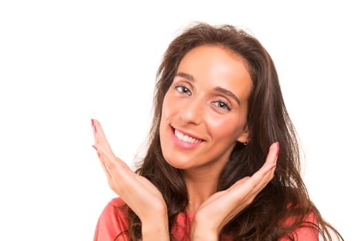 Beautiful young woman posing isolated over white background