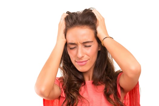 Young student tired of studying for the final exams, isolated over a white background