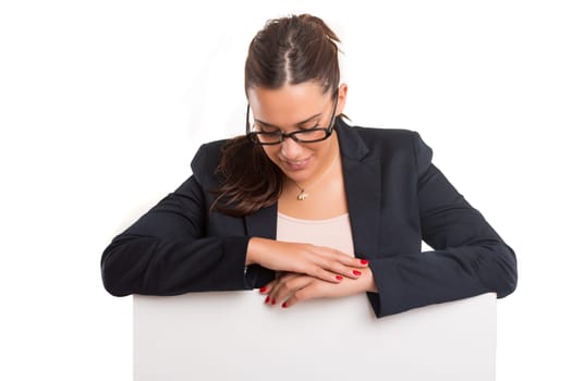 Young business woman presenting your product over a white card