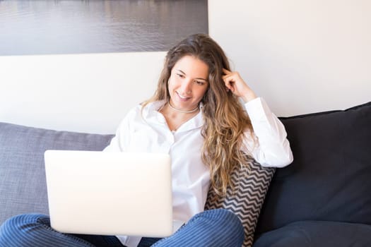 Beautiful woman relaxing with a computer