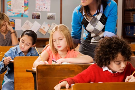 Students with their teacher in a classroom