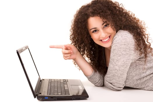 Young asian student working with her laptop, isolated over a white background