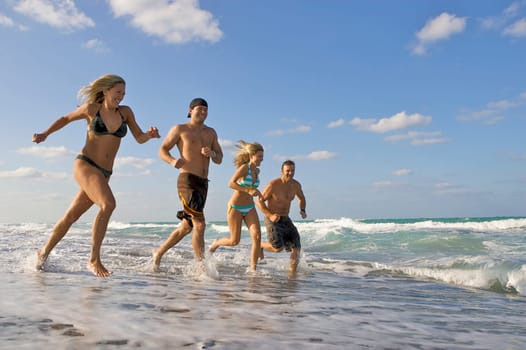 Couples running on the beach