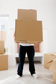 Person carrying cardboard boxes