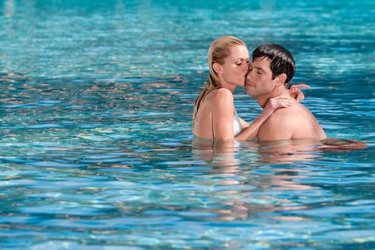 Couple romancing in a swimming pool, Biltmore Hotel, Coral Gables, Florida, USA