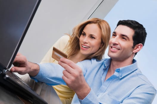 Low angle view of a mid adult couple shopping online