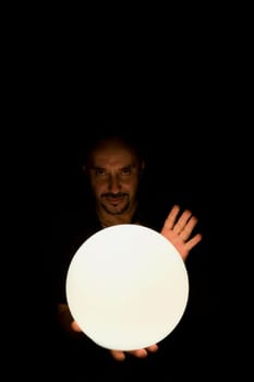 Man holding a crystal ball