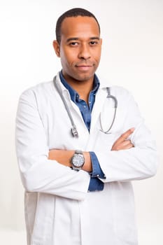 Handsome young african doctor posing isolated over a white background