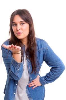 Beautiful young woman blowing you a kiss, isolated over white