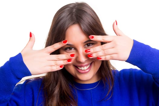 Woman showing her perfect nails, isolated over white