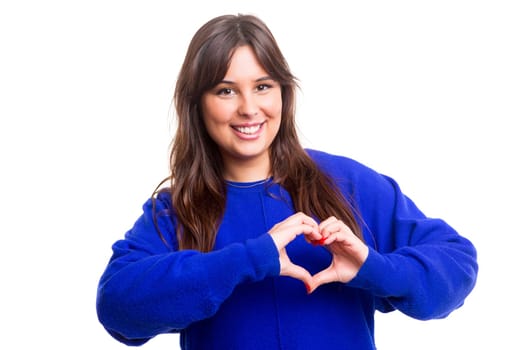 Beautiful woman making a heart shape with her hands, isolated over white background