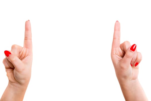 Cropped view of two hands pointing their index fingers upwards