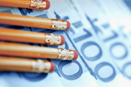 Close_up of pencils on European union banknotes