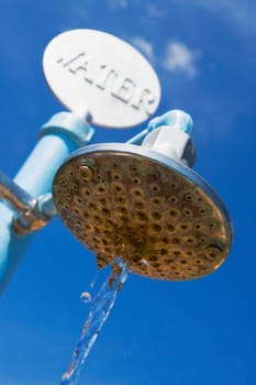 Low angle view of water dripping from a beach shower, Miami Beach, Florida, USA
