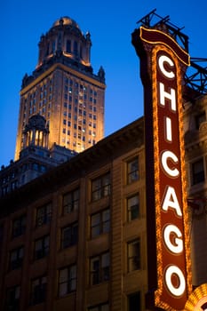 Low angle view of Chicago neon sign lit up at dusk, Chicago Theatre, Chicago, Illinois, USA