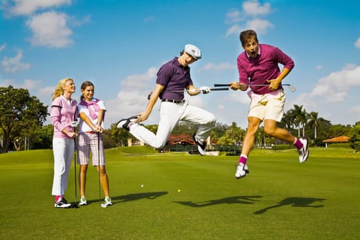 Four friends having fun in a golf course, Biltmore Golf Course, Coral Gables, Florida, USA