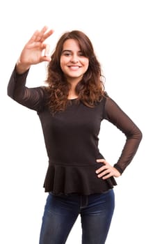 Beautiful young woman signaling ok, isolated over white