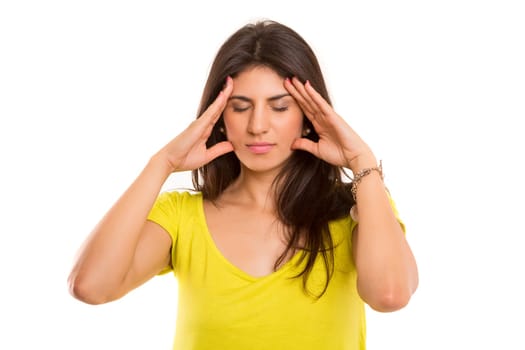 Young student tired of studying for the final exams, isolated over a white background