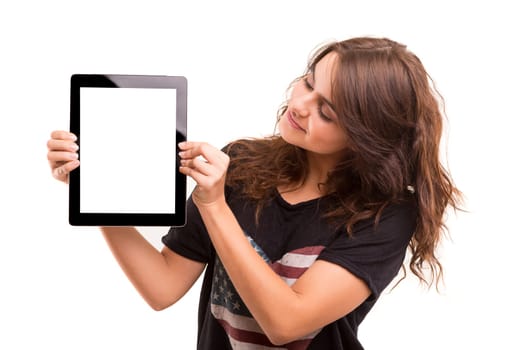 Happy young woman presenting your product in a tablet computer