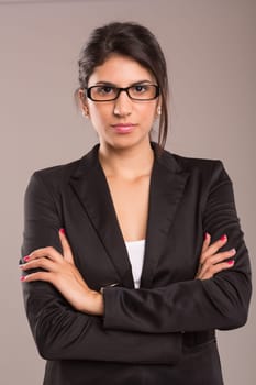 Beautiful young business woman posing isolated over copy space background