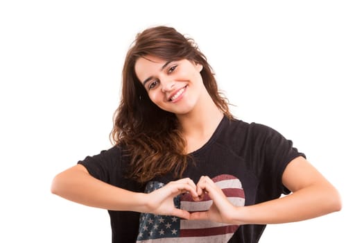 Beautiful woman making a heart shape with her hands, isolated over white background