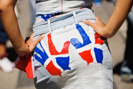 Mid section view of a woman with flags printed on her clothing
