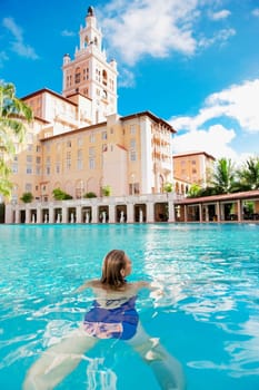Woman in a swimming pool, Biltmore Hotel, Coral Gables, Florida, USA