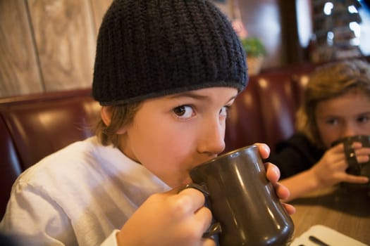 Portrait of a boy drinking tea