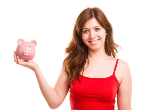 Young woman holding a piggy bank (money box) - savings concept