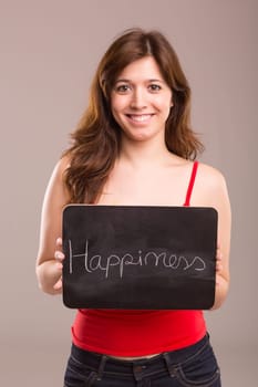 Young beautiful woman holding a small black board